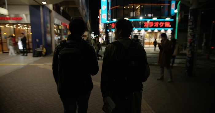 Two guys walking in Tokyo